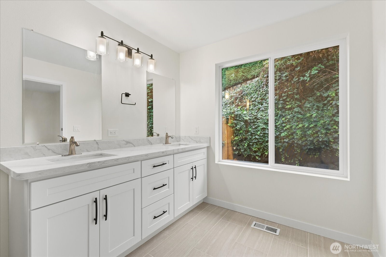 422 East Titus Street Kent, WA 98030 - Photo 19 of 28 a bathroom with a double vanity sink and mirror with window