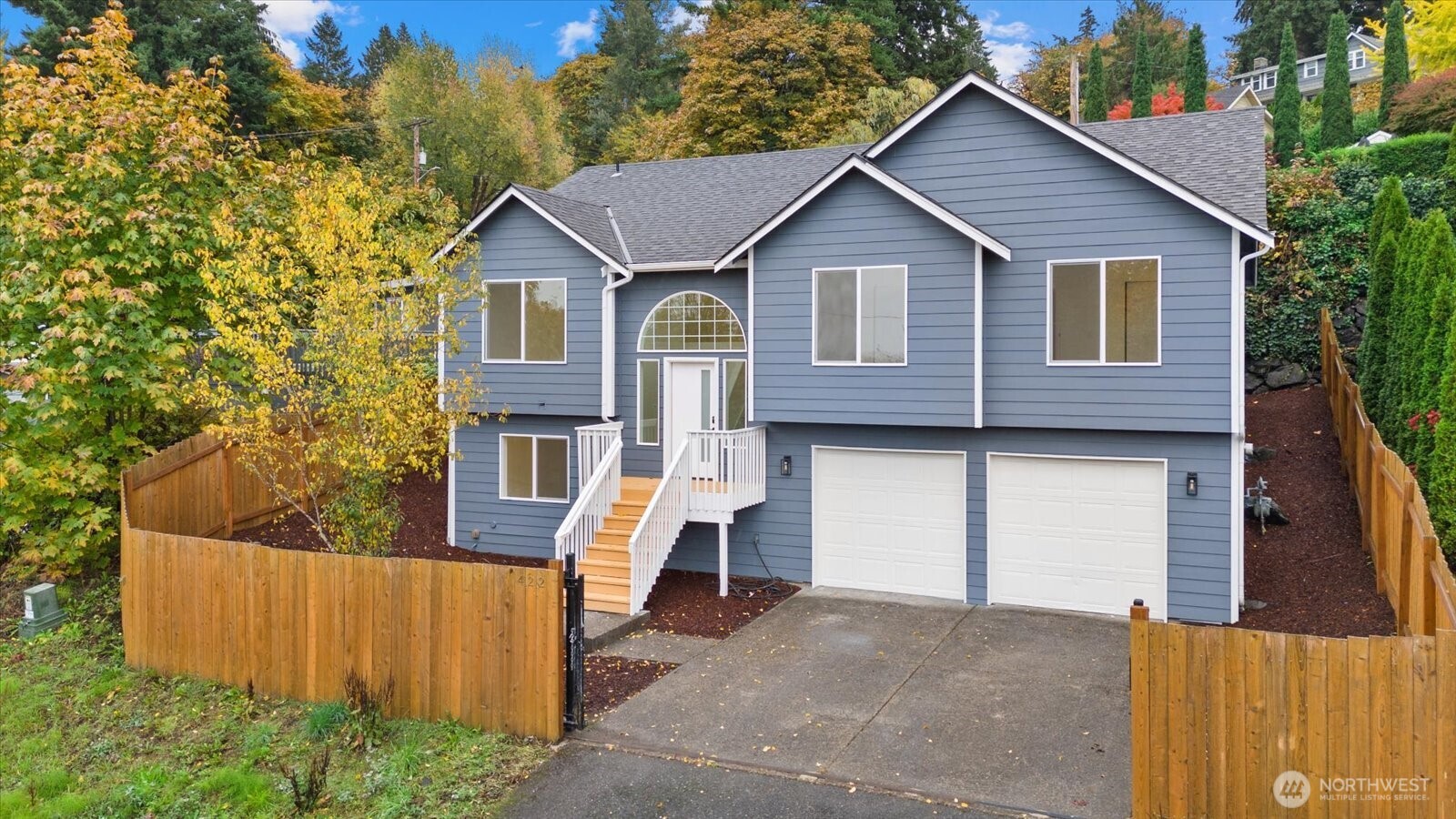 422 East Titus Street Kent, WA 98030 - Photo 2 of 28 a front view of a house with a yard and garage