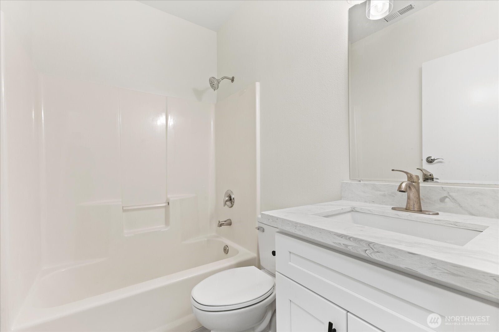 422 East Titus Street Kent, WA 98030 - Photo 22 of 28 a bathroom with a granite countertop bathtub shower sink vanity mirror and toilet