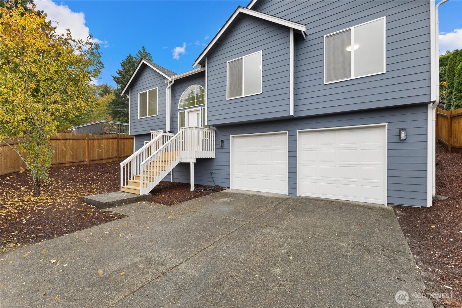 422 East Titus Street Kent, WA 98030 - Photo 3 of 28 a view of a house with a yard and garage