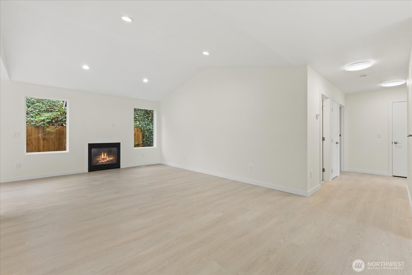 422 East Titus Street Kent, WA 98030 - Photo 5 of 28 an empty room with a fireplace and a window