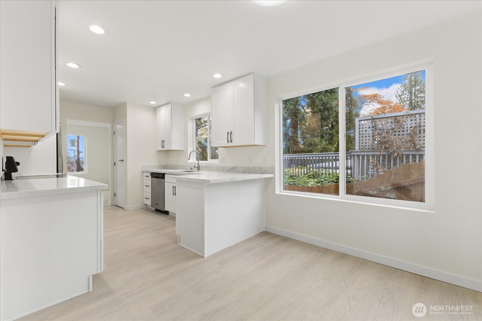 422 East Titus Street Kent, WA 98030 - Photo 7 of 28 a kitchen with white cabinets and sink