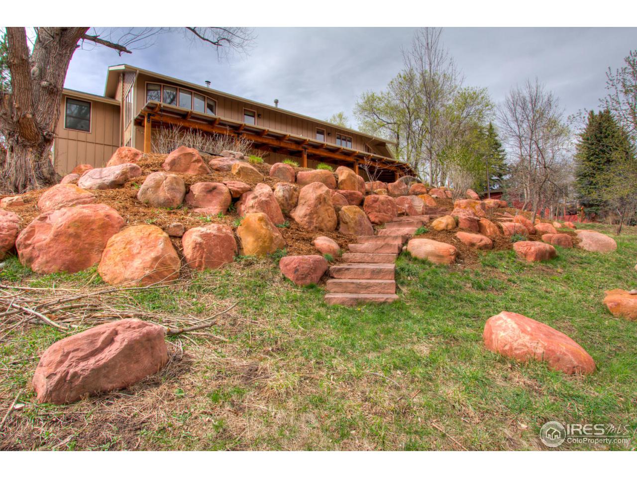 1908 Apple Valley Road Lyons, CO 80540 - Photo 3 of 40 a backyard of a house with lots of green space