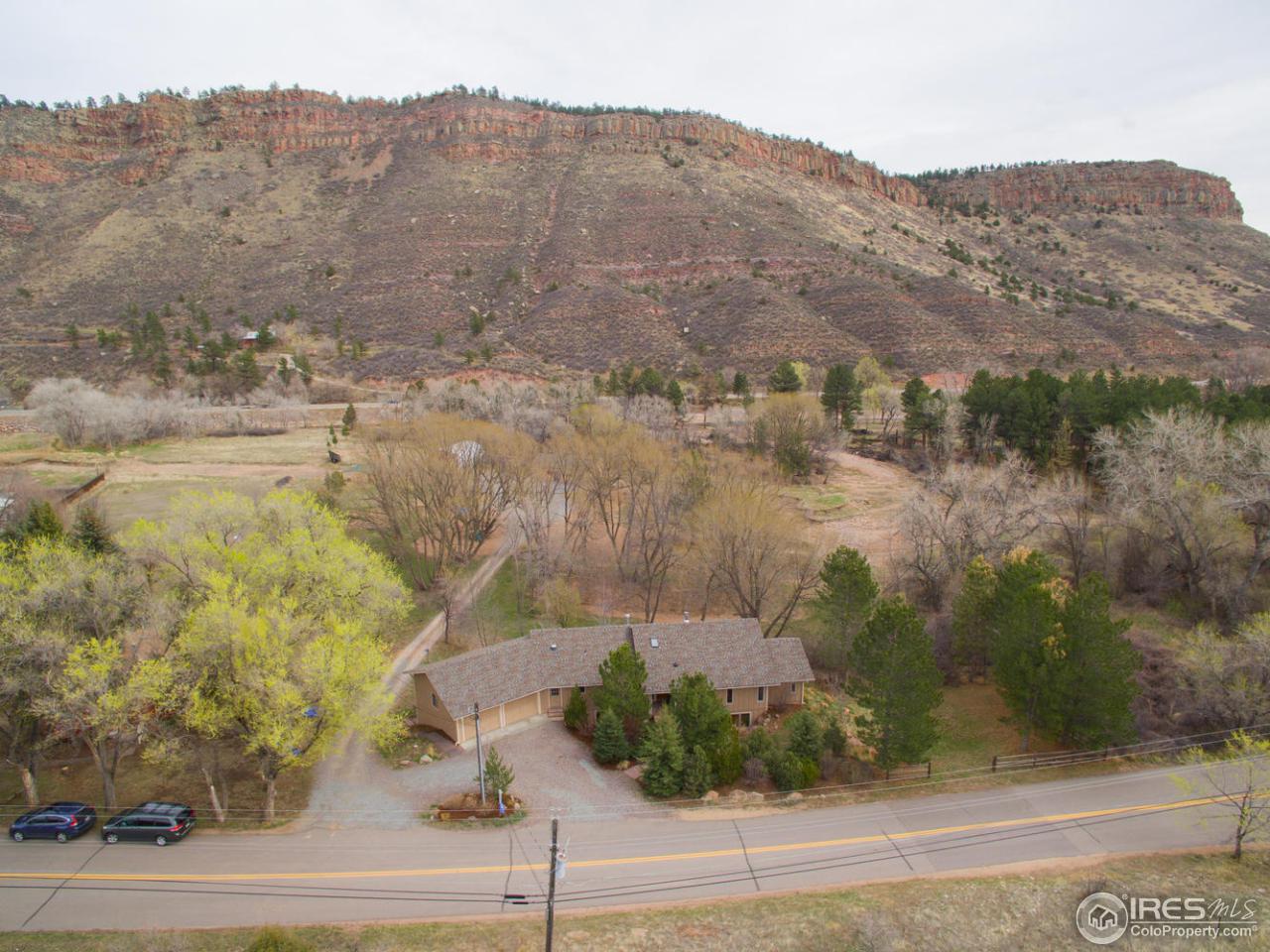 1908 Apple Valley Road Lyons, CO 80540 - Photo 5 of 40 a view of a dry yard with mountains