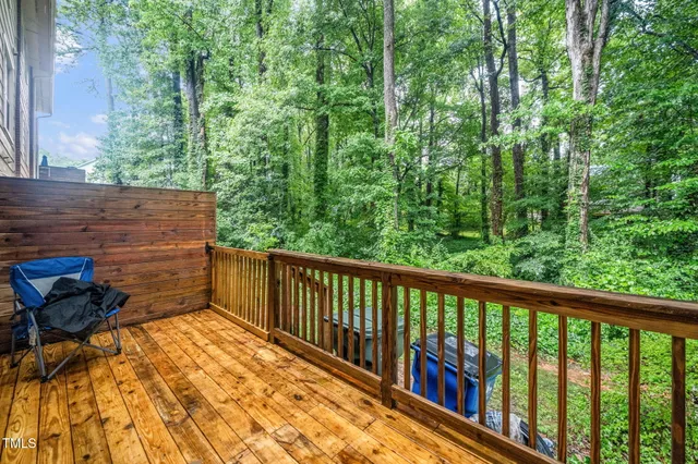 a front view of a house with trees