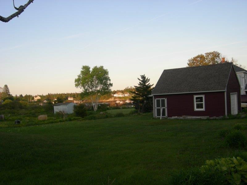 646-a&b Corea Road Corea, ME 04624 - Photo 16 of 16 The back lawn and garage with view...