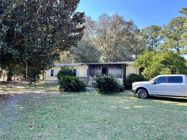 a view of backyard with a garden and entertaining space