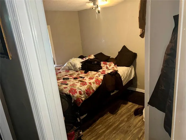 a bedroom with a bed and a window