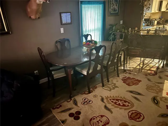 a living room with fireplace furniture and a window