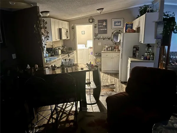 a bathroom with a toilet a sink and a mirror