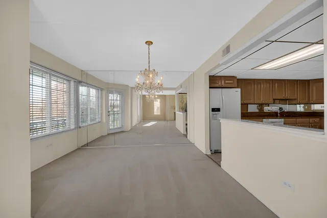 a kitchen with stainless steel appliances granite countertop a sink a stove and cabinets