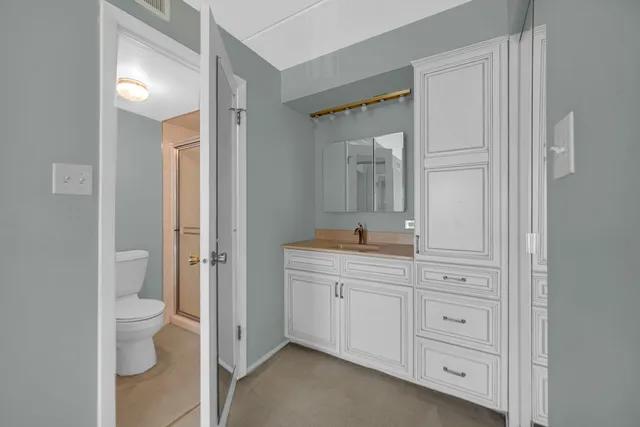 a kitchen with a sink and cabinets