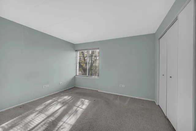 a bathroom with a granite countertop sink a mirror and a shower