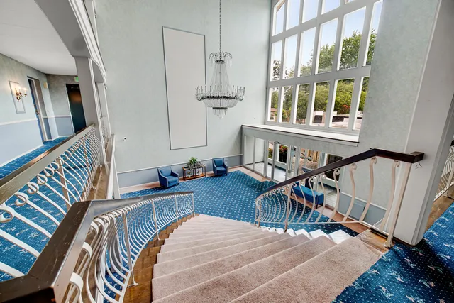 a bedroom with furniture and a window