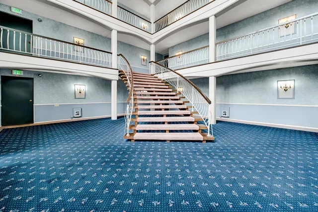 a view of a livingroom with stairs and stairs