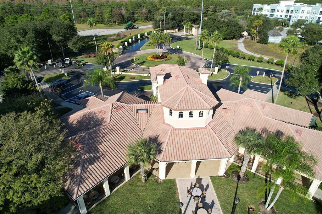 8762 Worldquest Boulevard, Unit 5103 Orlando, FL 32821 - Photo 21 of 30 an aerial view of a house with a garden and trees