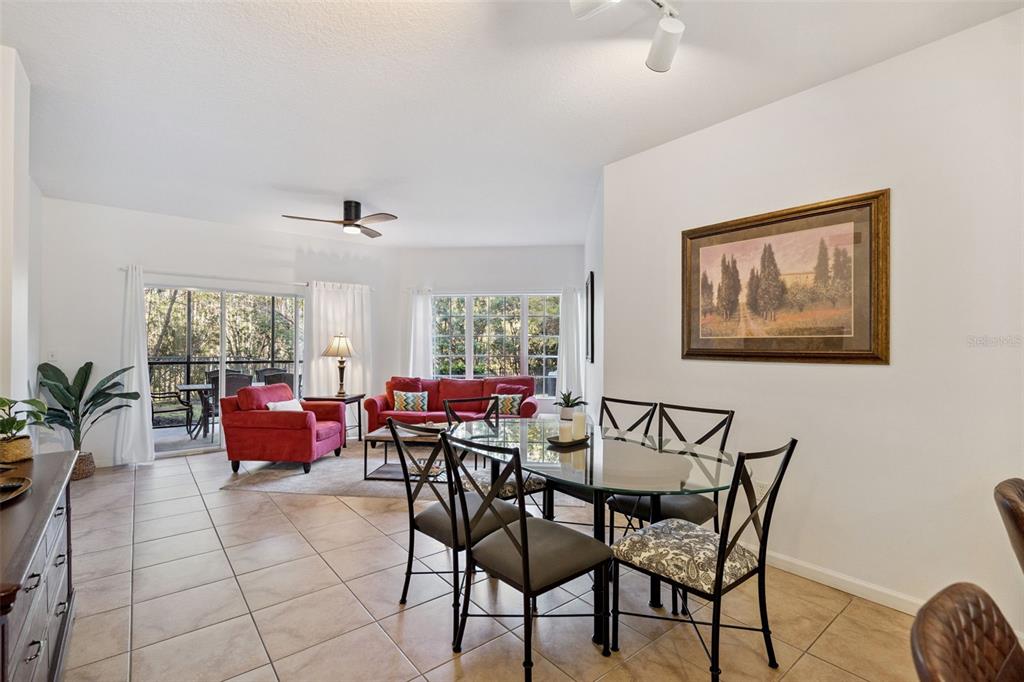 8762 Worldquest Boulevard, Unit 5103 Orlando, FL 32821 - Photo 6 of 30 a view of a dining room with furniture window and outside view