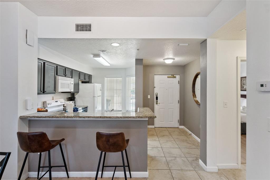 8762 Worldquest Boulevard, Unit 5103 Orlando, FL 32821 - Photo 8 of 30 a bathroom with a sink and a mirror