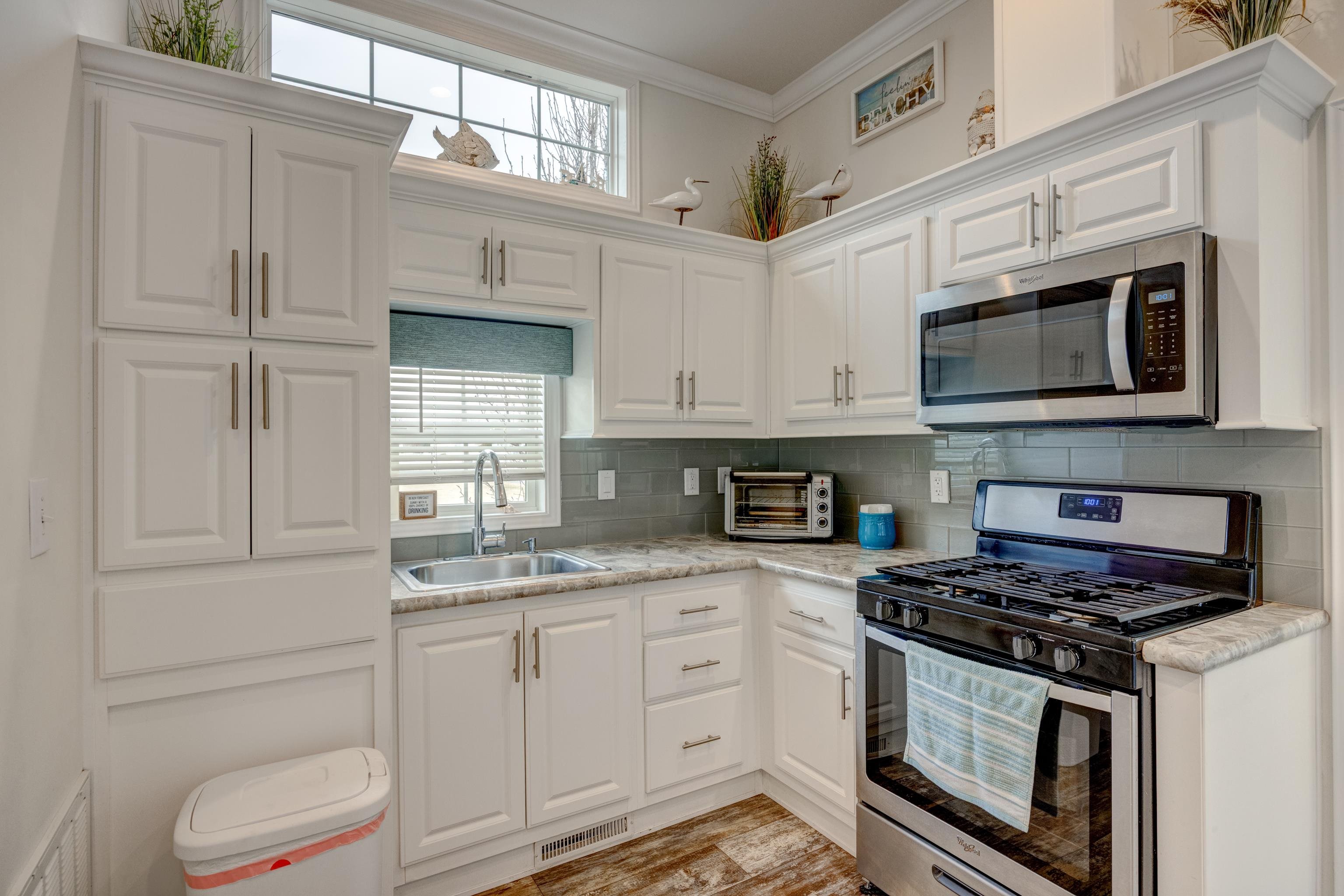 4100 Rte 9 South, Unit 117 Rio Grande, NJ 08242 - Photo 10 of 21 a kitchen with cabinets stainless steel appliances and a sink