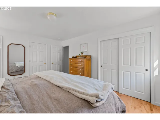 a bedroom with a bed and a dresser