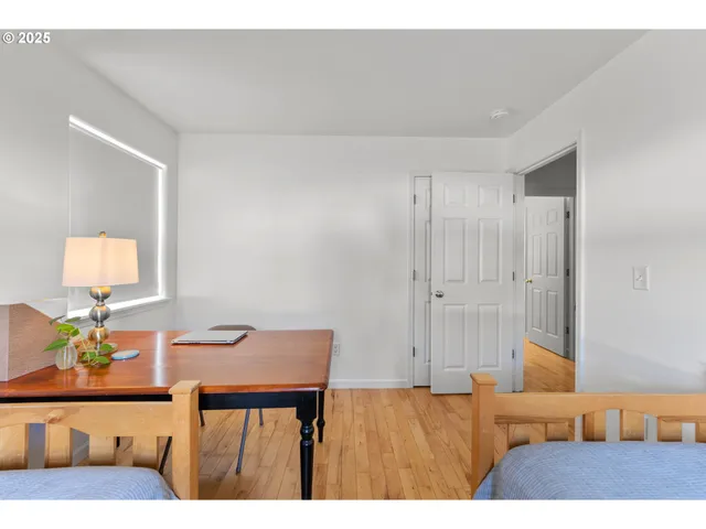 a bedroom with furniture and a window