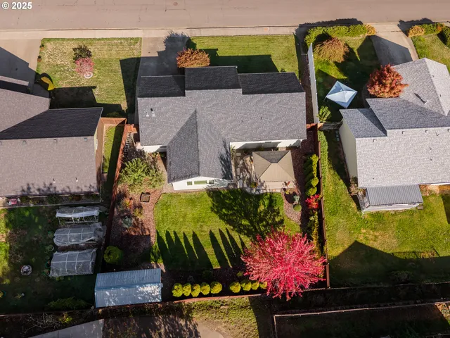 an aerial view of houses with outdoor space