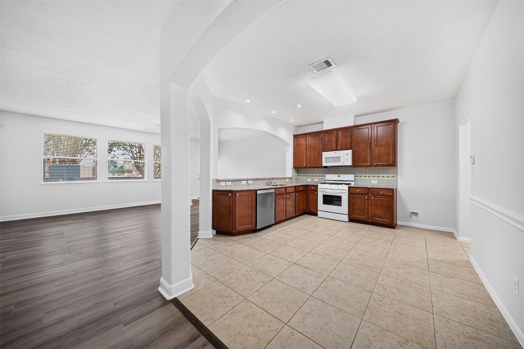 10510 Day Trail Lane Spring, TX 77379 - Photo 4 of 28 The home offers plenty of natural light and space for you to enjoy and entertain where the kitchen and dining area seamlessly blend.