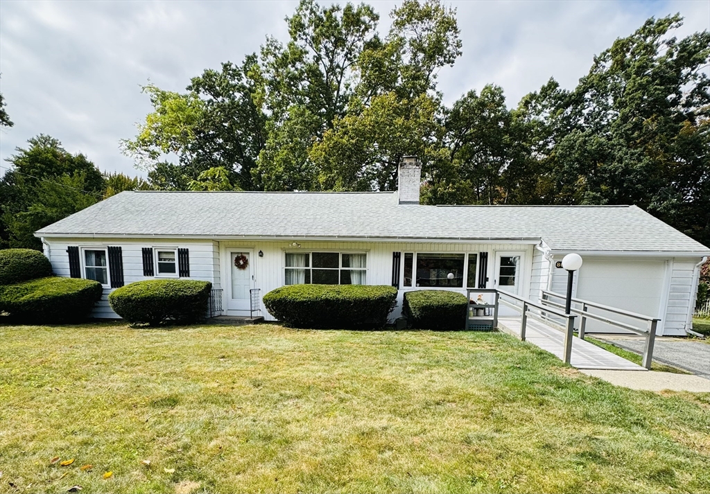 80 Jeffrey Road Springfield, MA 01119 - Photo 1 of 32 a front view of a house with a yard and garage