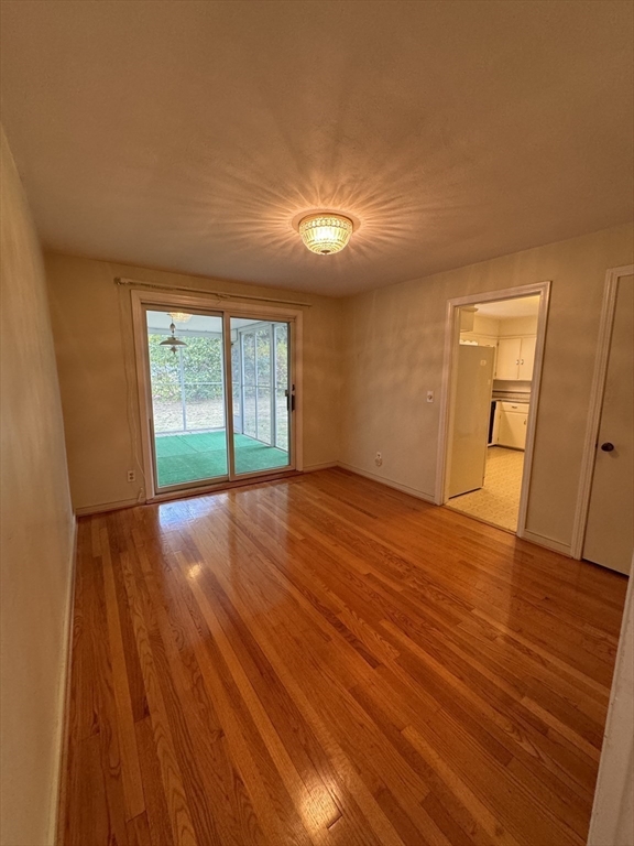 80 Jeffrey Road Springfield, MA 01119 - Photo 12 of 32 wooden floor in an empty room with a window