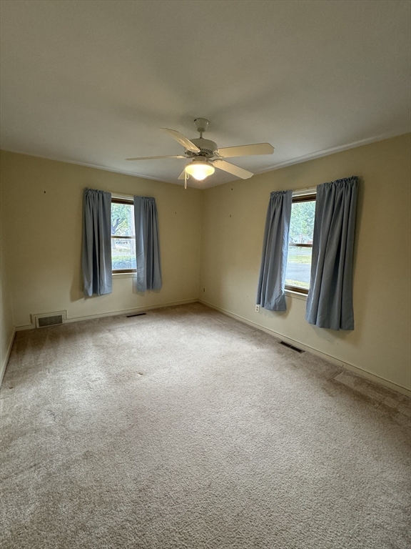 80 Jeffrey Road Springfield, MA 01119 - Photo 14 of 32 an empty room with windows and ceiling fan