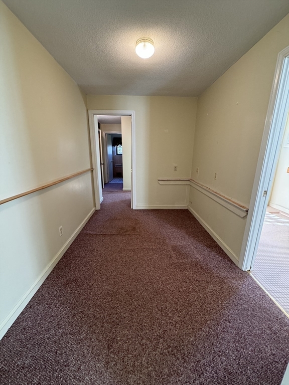 80 Jeffrey Road Springfield, MA 01119 - Photo 19 of 32 an empty room with an entryway and fan