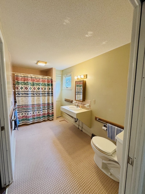 80 Jeffrey Road Springfield, MA 01119 - Photo 20 of 32 a bathroom with a sink mirror vanity and toilet