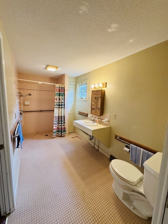 80 Jeffrey Road Springfield, MA 01119 - Photo 21 of 32 a bathroom with a sink mirror vanity and toilet
