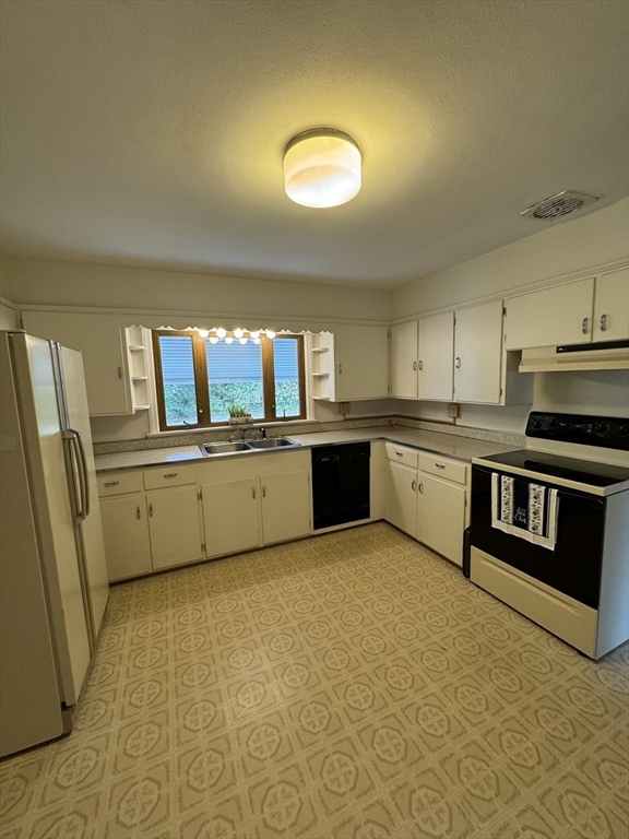 80 Jeffrey Road Springfield, MA 01119 - Photo 6 of 32 a kitchen with stainless steel appliances granite countertop a stove a sink and a refrigerator
