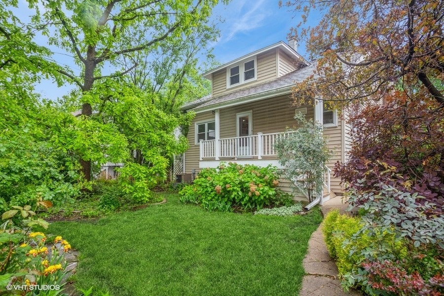 108 Belle Plaine Avenue Park Ridge, IL 60068 - Photo 11 of 16 a front view of a house with a garden