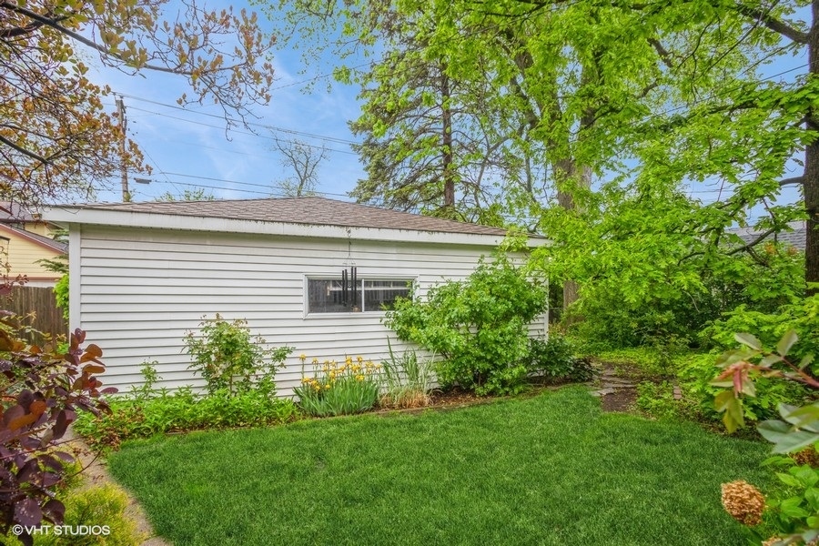 108 Belle Plaine Avenue Park Ridge, IL 60068 - Photo 12 of 16 a view of backyard with potted plants and large tree
