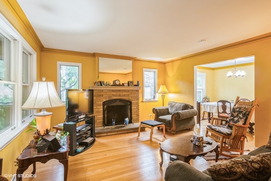 108 Belle Plaine Avenue Park Ridge, IL 60068 - Photo 2 of 16 a living room with furniture or fireplace and a floor to ceiling window