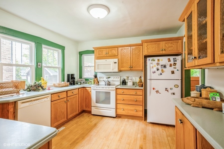 108 Belle Plaine Avenue Park Ridge, IL 60068 - Photo 4 of 16 a kitchen with stainless steel appliances a stove a sink and a refrigerator