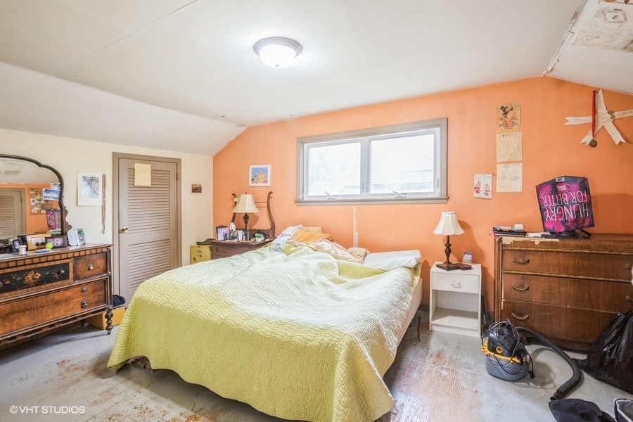 108 Belle Plaine Avenue Park Ridge, IL 60068 - Photo 5 of 16 a bedroom with a bed and wooden furniture