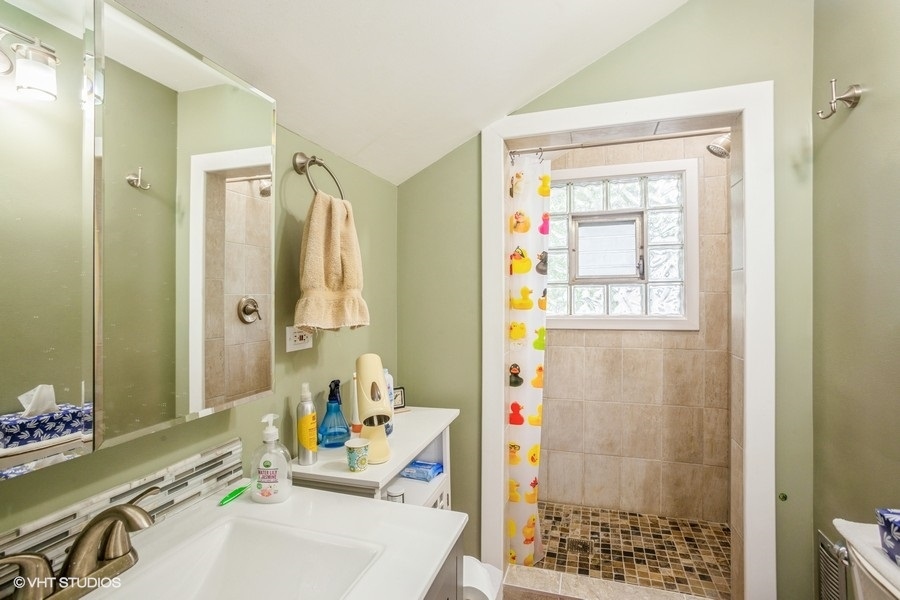 108 Belle Plaine Avenue Park Ridge, IL 60068 - Photo 8 of 16 a bathroom with a sink toilet and shower