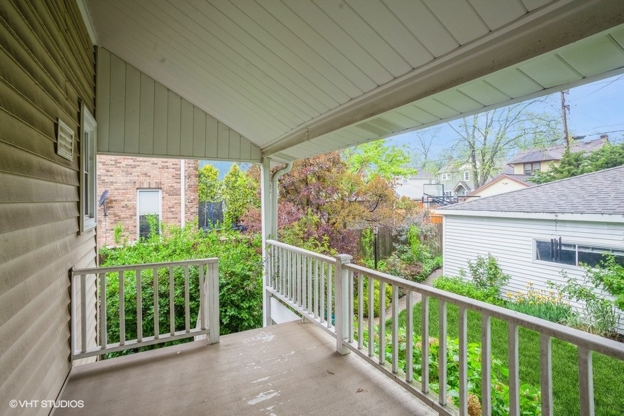 108 Belle Plaine Avenue Park Ridge, IL 60068 - Photo 10 of 16 a view of a house with a large window and wooden fence