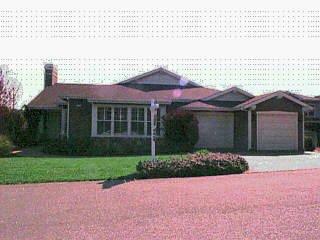 515 Point San Pedro Road San Rafael, CA 94901 - Photo 1 of 1 a front view of a house with a yard and garage