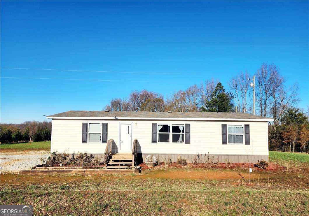 3525 Athens Road Royston, GA 30662 - Photo 1 of 1 front view of a house with a patio