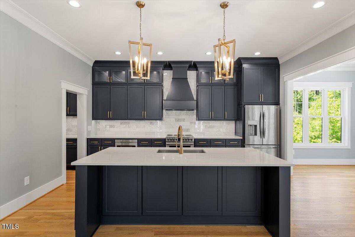 3934 Old Chapel Hill Road Durham, NC 27707 - Photo 3 of 47 a kitchen with stainless steel appliances kitchen island granite countertop a cabinets