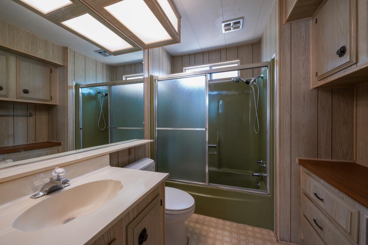13 Primrose Street, Unit 13 Aptos, CA 95003 - Photo 11 of 15 a bathroom with a sink and a mirror