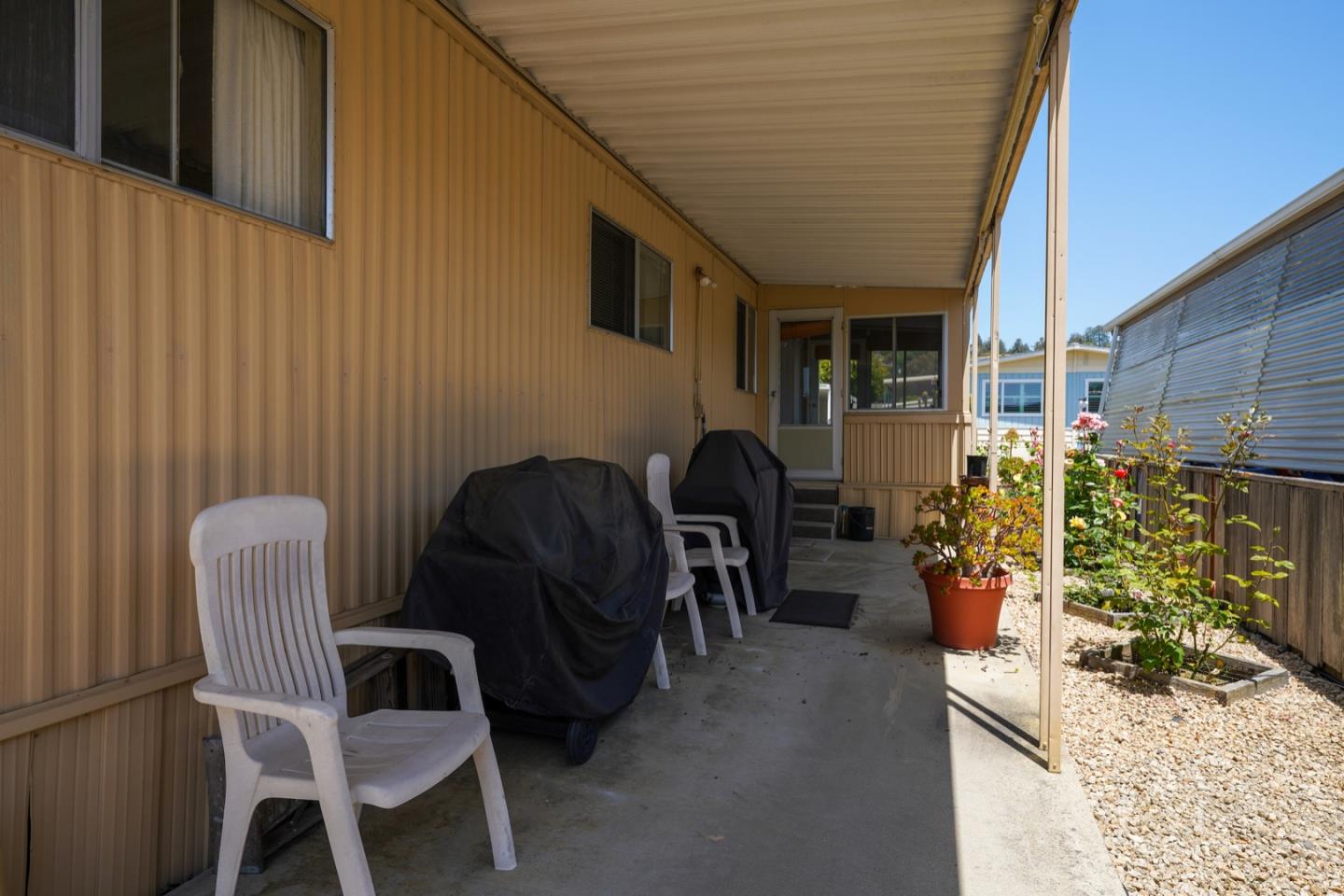 13 Primrose Street, Unit 13 Aptos, CA 95003 - Photo 15 of 15 a view of balcony with chairs and potted plants