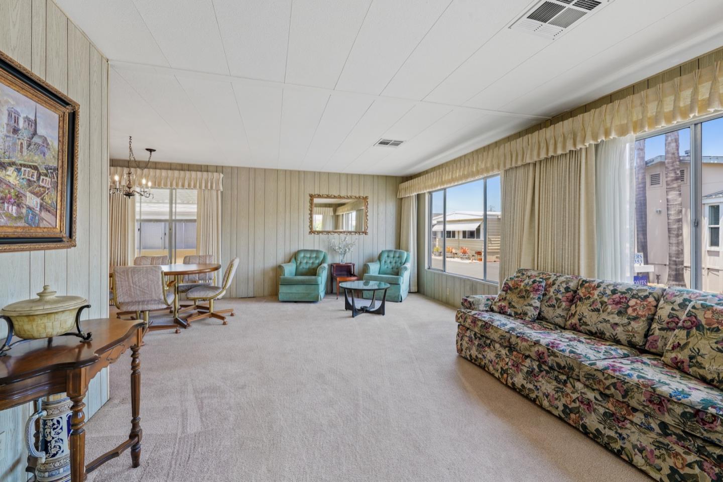 13 Primrose Street, Unit 13 Aptos, CA 95003 - Photo 3 of 15 a living room with furniture and large windows