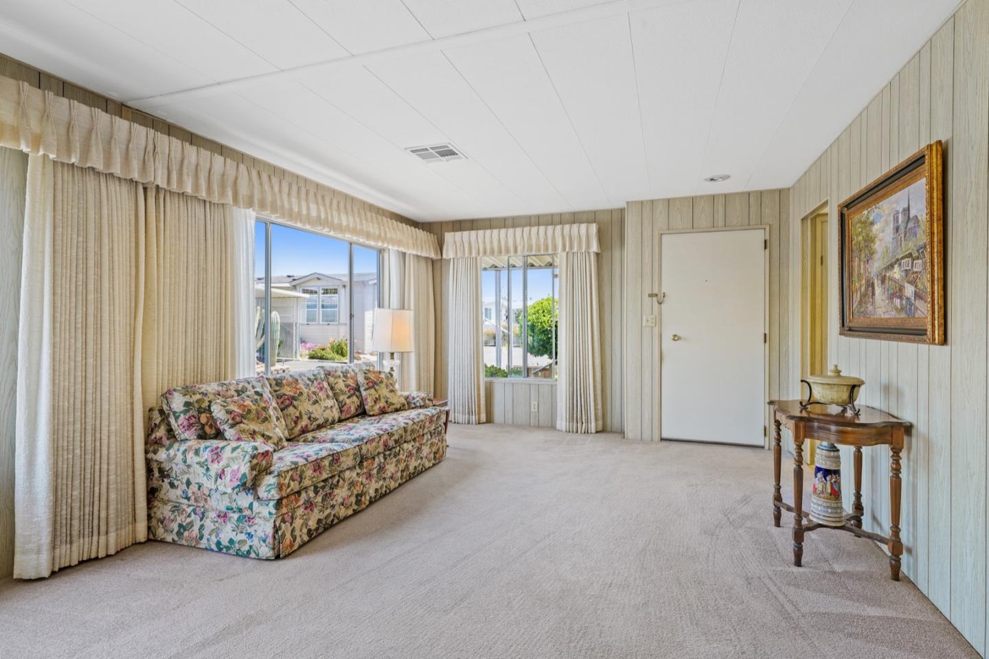 13 Primrose Street, Unit 13 Aptos, CA 95003 - Photo 4 of 15 a living room with furniture and a flat screen tv