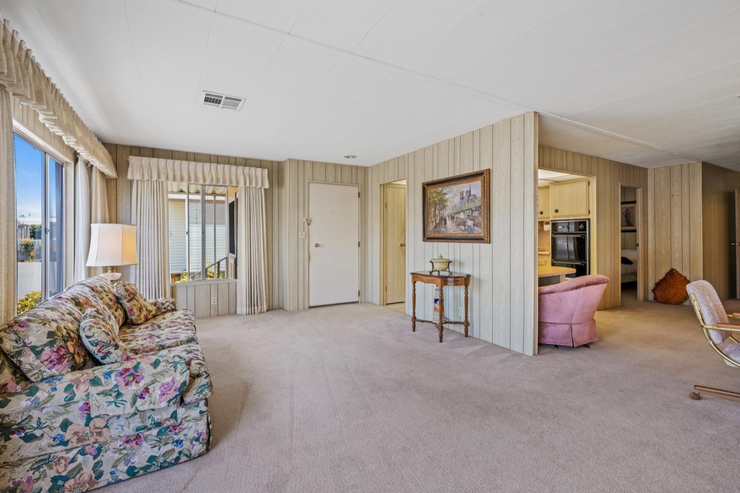 13 Primrose Street, Unit 13 Aptos, CA 95003 - Photo 5 of 15 a bedroom with furniture and large windows