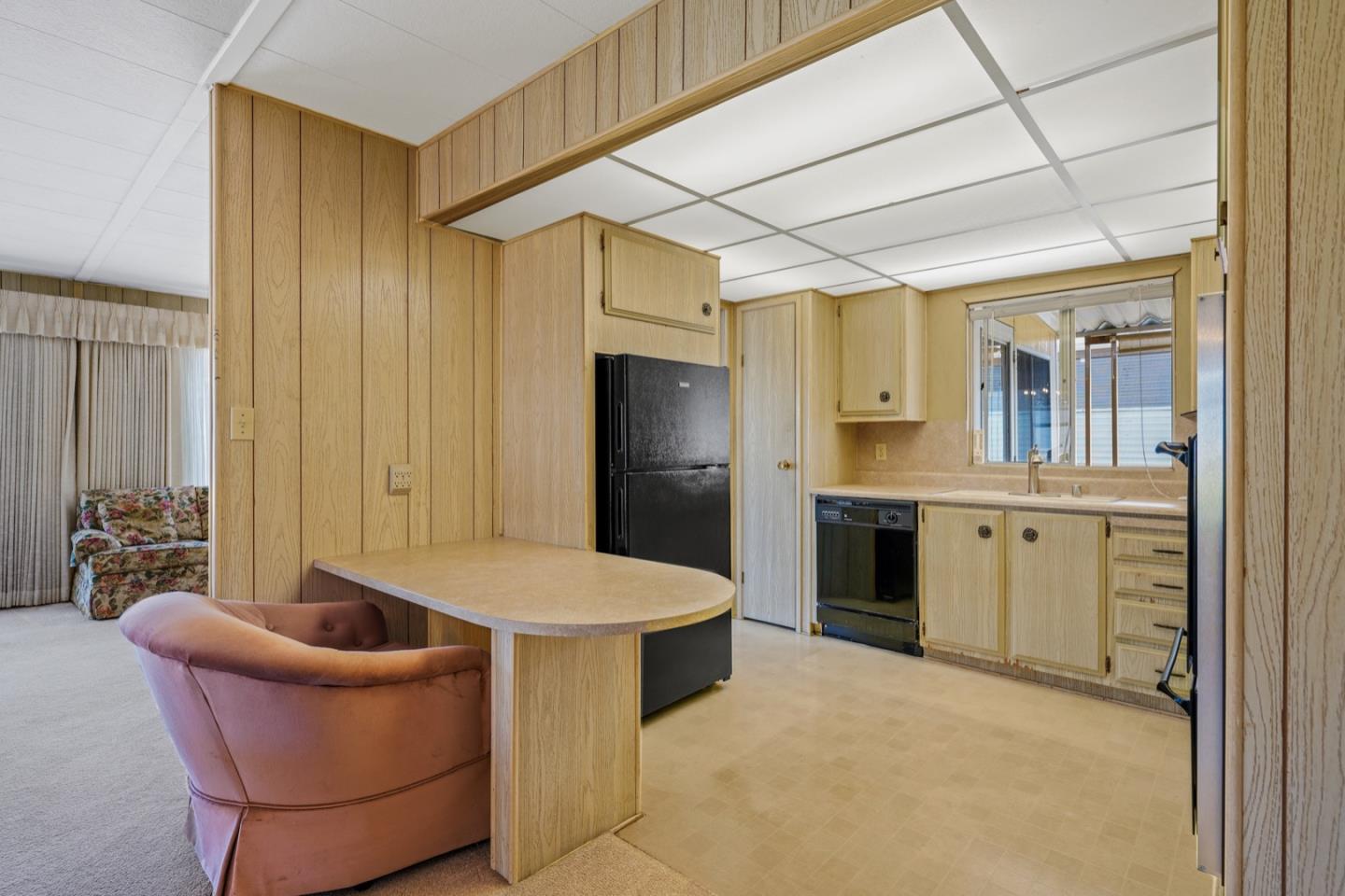 13 Primrose Street, Unit 13 Aptos, CA 95003 - Photo 7 of 15 a kitchen with stainless steel appliances kitchen island a refrigerator and a sink